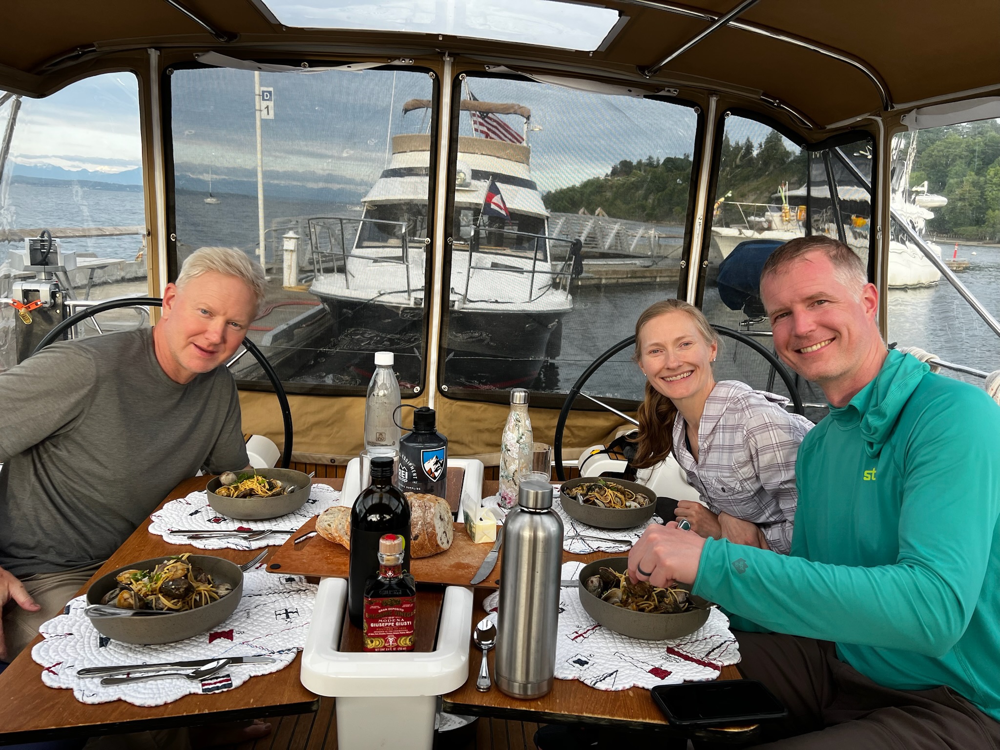 Three guests gathered around a cockpit meal.