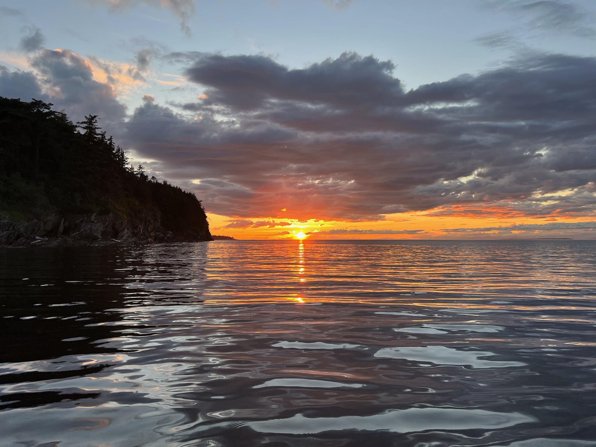 Sunset over calm water in the South Sound.